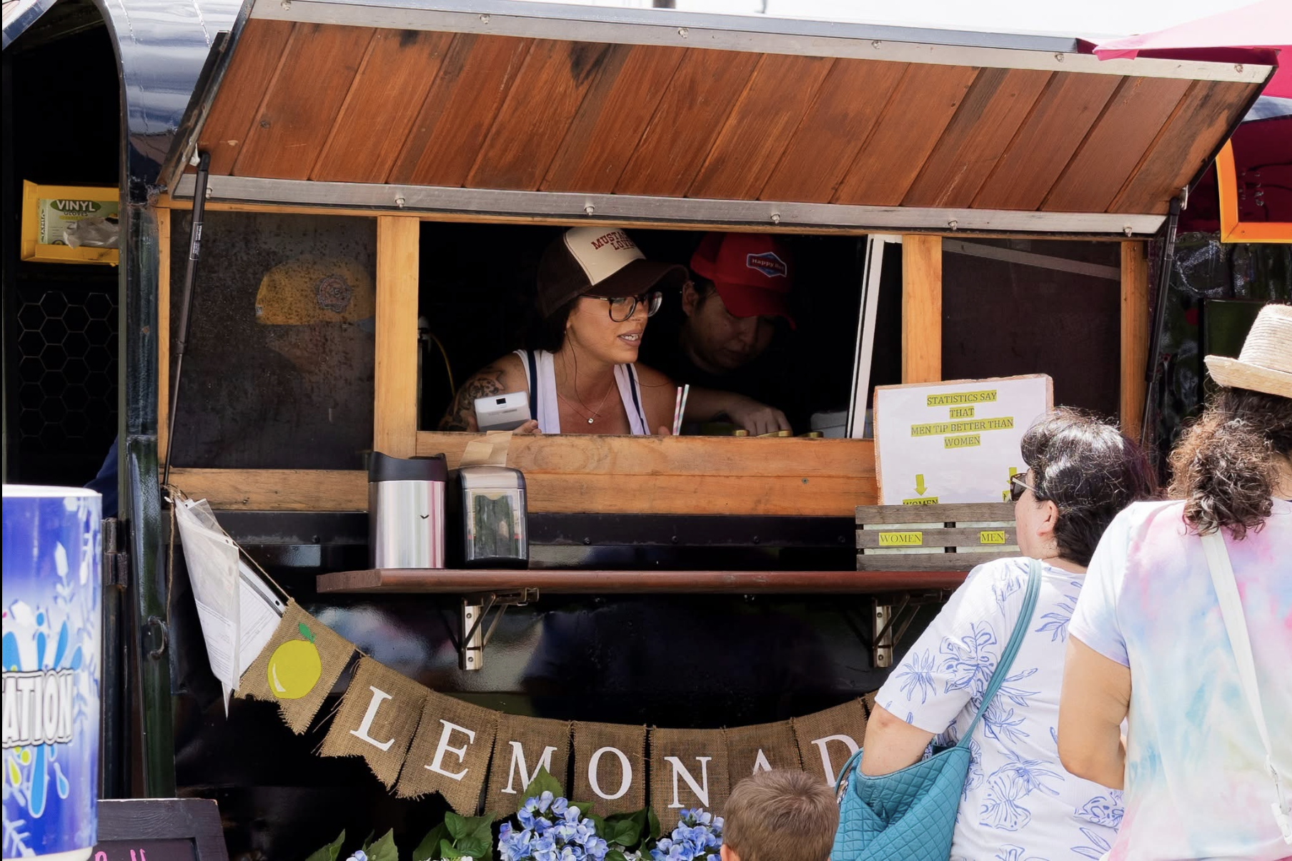 Jessica serving customers at the Snowie Texas lemonade cart